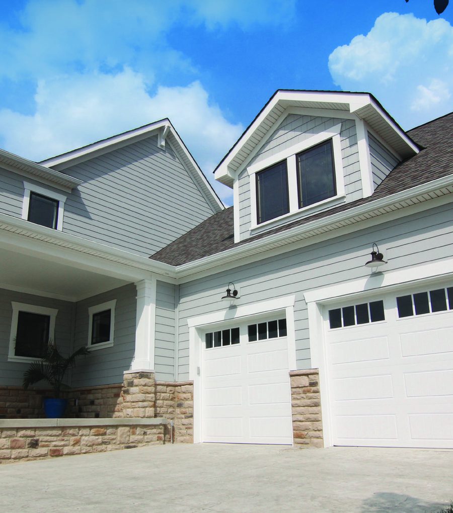 White garage door installation on modern home — Metro Vancouver, BC