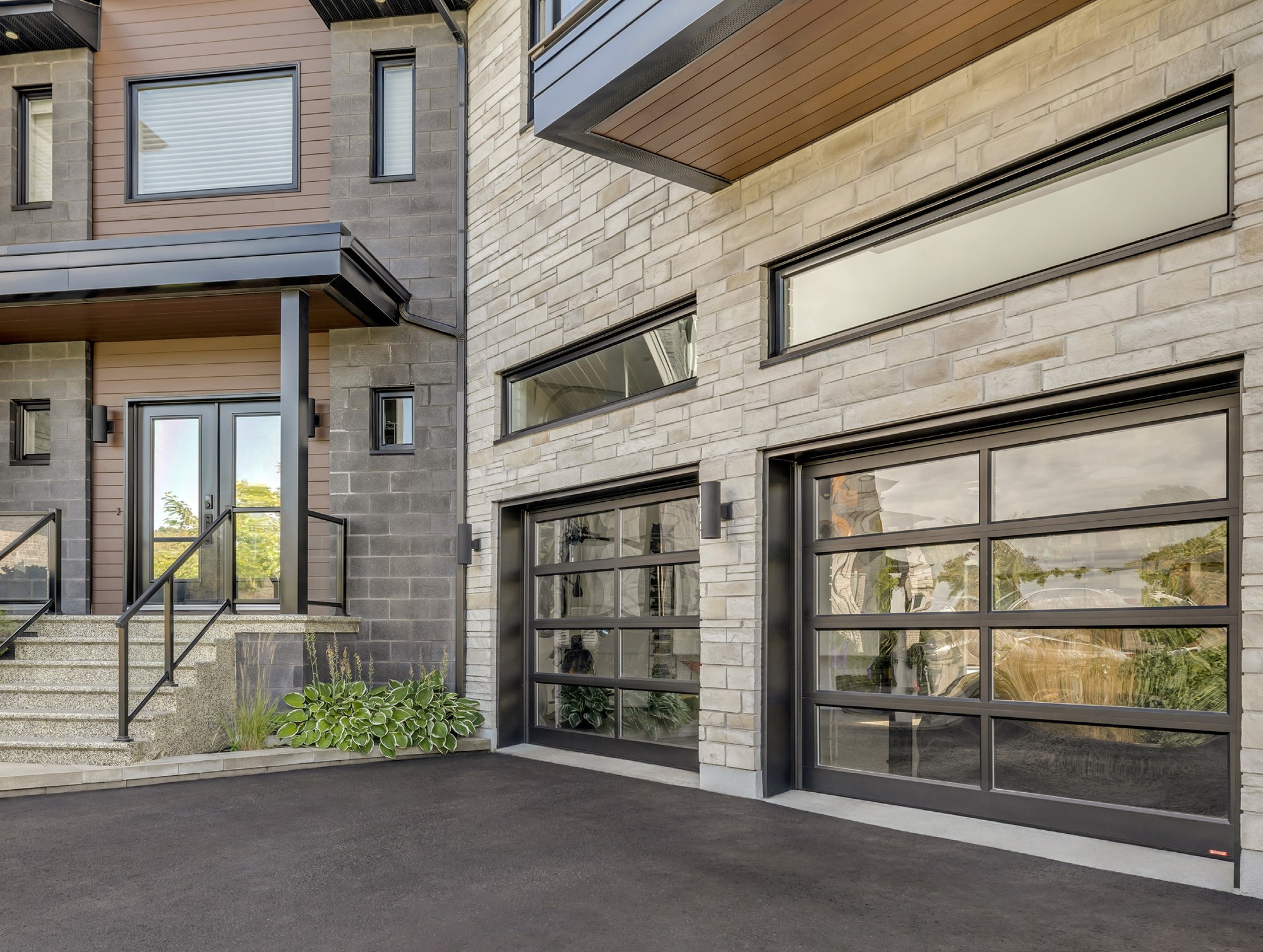 Modern flush garage door — black with slim windows