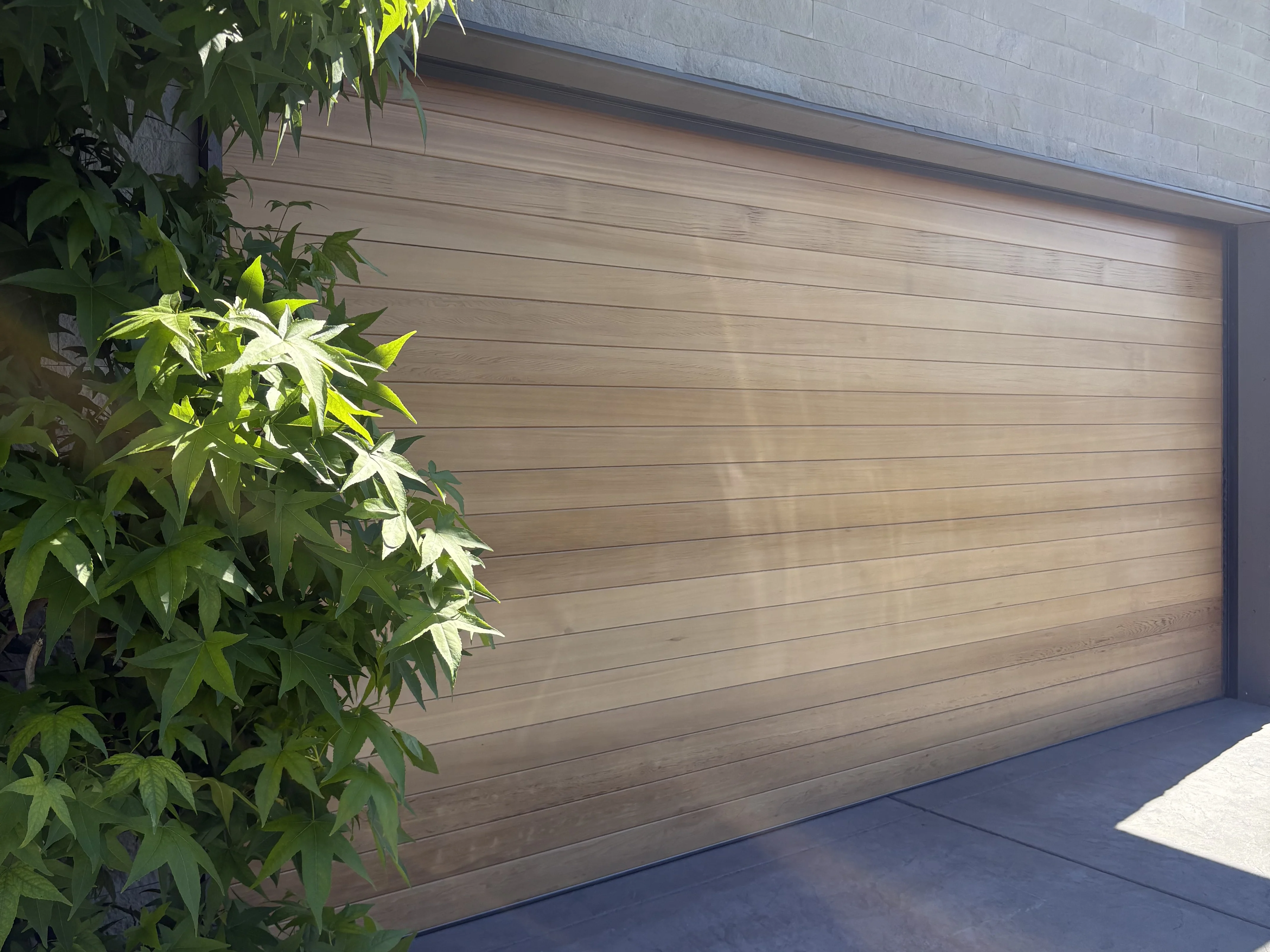 Cedar flush wood garage door — Metro Vancouver