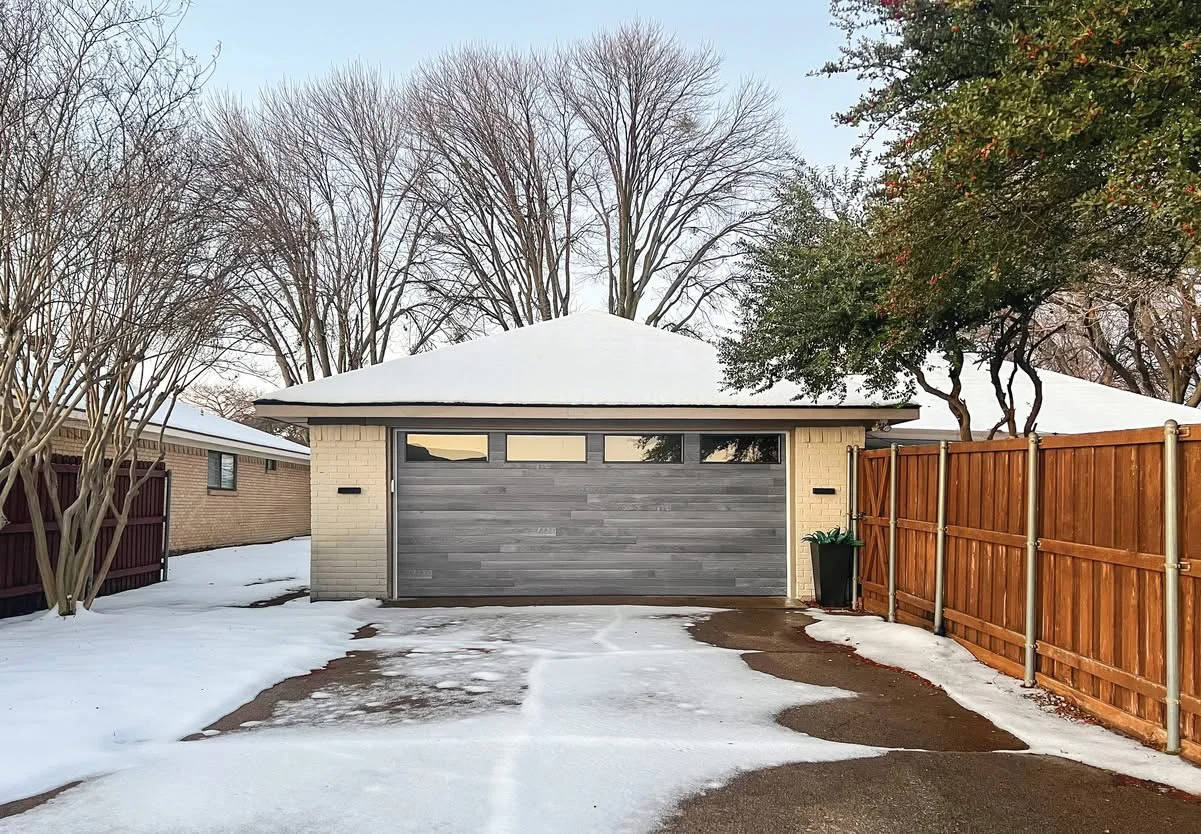 Premium woodgrain steel garage door finish detail on a Fraser Valley, BC home